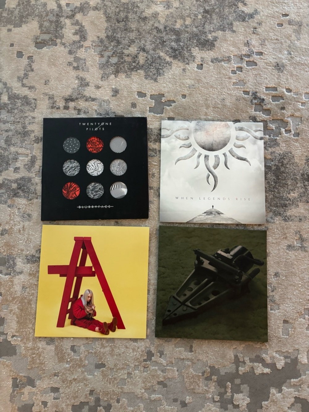 Four Album Vinyl Covers — Black, White, Yellow, Olive Green